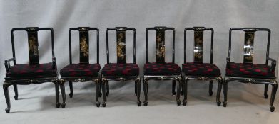 A set of six black lacquered dining chairs with Chinoiserie decoration and figures to the back