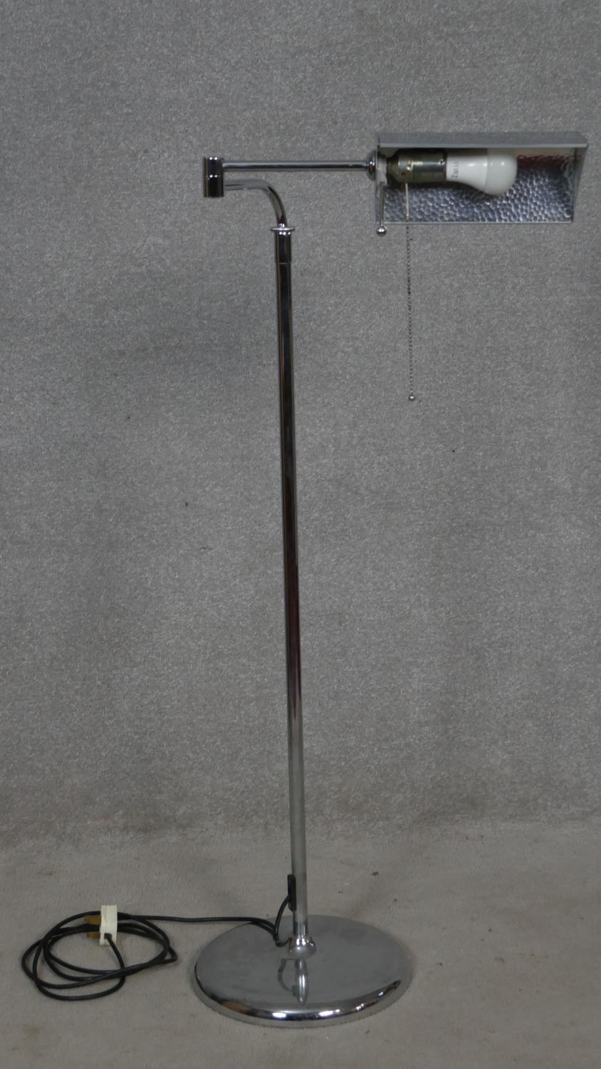A contemporary chrome adjustable standard reading lamp. H.111 to 165cm