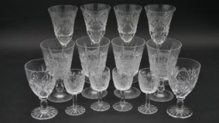 A collection of fourteen cut crystal glasses. Including a set of four engraved and cut crystal