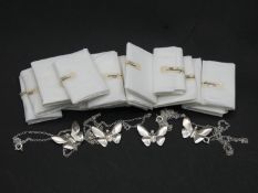 Twenty as new sterling silver butterfly pendants on chains. Stamped Lesley, Silver. Each with secure