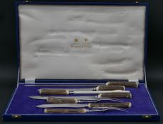 A Mappin and Webb deer antler seven piece carving set in blue leather effect case. Makers marks. H.