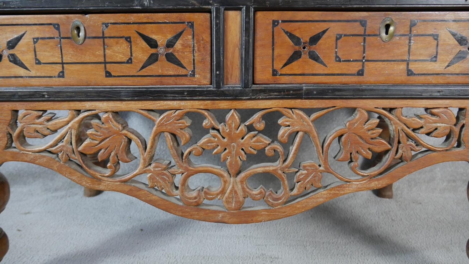 A Nineteenth Century Ceylonese hardwood and ebonised coffer on carved stand fitted with two base - Image 3 of 6