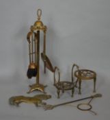 A brass fireside companion set, two trivets and various brass items. H.58cm (companion set)
