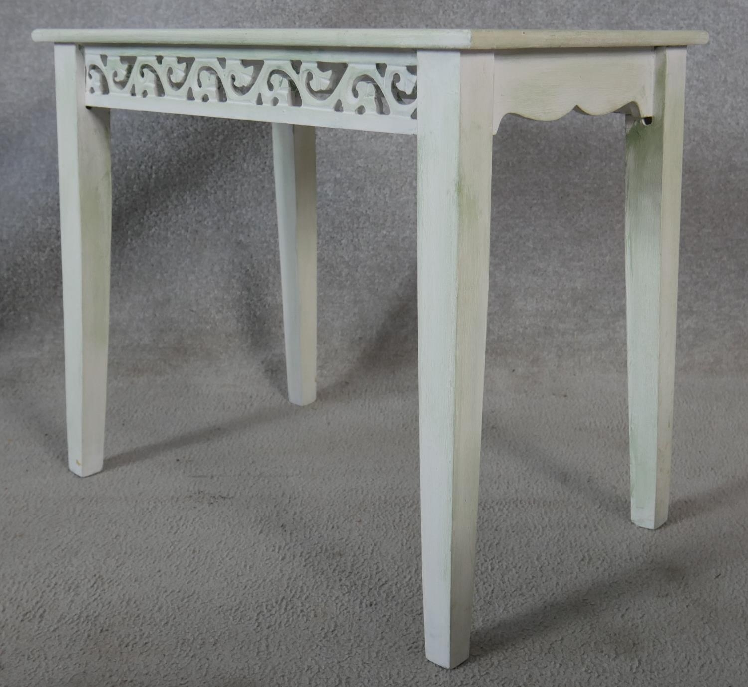 A nest of three graduating painted Eastern tables with carved friezes raised on square tapering - Image 3 of 5