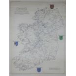 A framed and glazed hand coloured map of Ireland. Showing the principal Irish families and regions