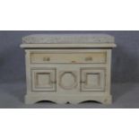 A Continental painted side cabinet with sandstone slab top on shaped bracket feet. H.67 W.91 D.61cm