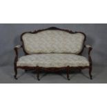 A 19th century carved mahogany canape in floral upholstery with four cabriole front supports. H.99
