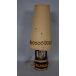 A vintage West German Pottery table lamp with fat lava glaze and its original woven shade. H.78cm (