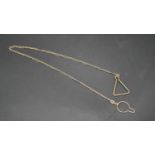 A 9 carat yellow gold antique fancy link chain with triangular fitting to one end and a circular