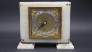 A vintage Elliot white alabaster and gilt mantle clock, retailed by Garrard & Co, Ltd, Regent