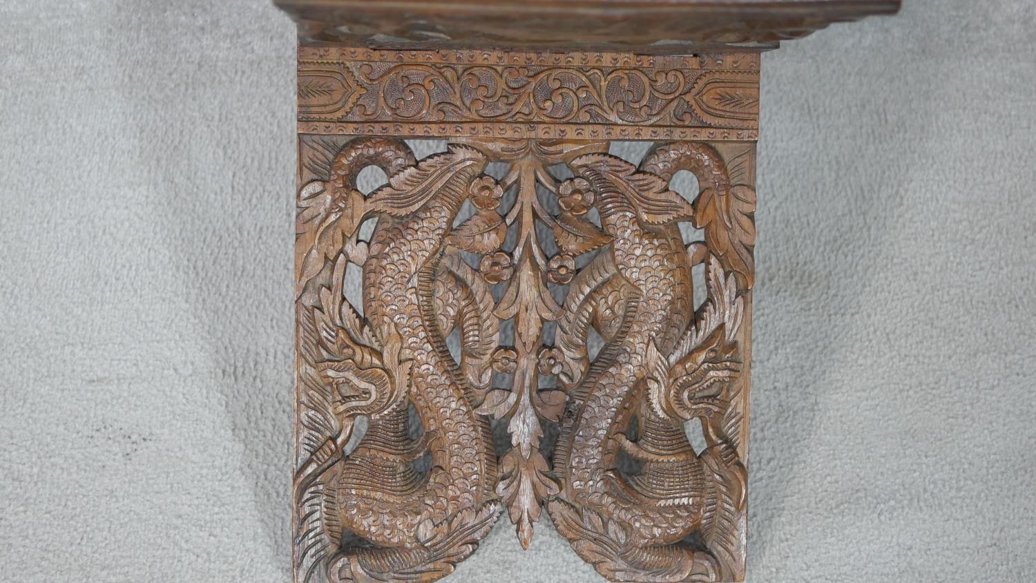 An Anglo-Indian carved pierced hardwood book stand. Decorated with dragons, foliage and flowers - Image 3 of 6