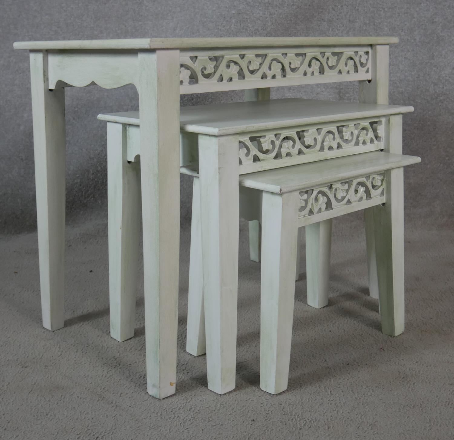 A nest of three graduating painted Eastern tables with carved friezes raised on square tapering - Image 5 of 5