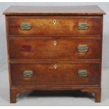 A compact Georgian mahogany chest of three long drawers on bracket feet. H.75.5 W.79 D.45.5cm (one