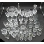 An extensive collection of glass to include cut crystal, drinking glasses, decanters, comports, wine