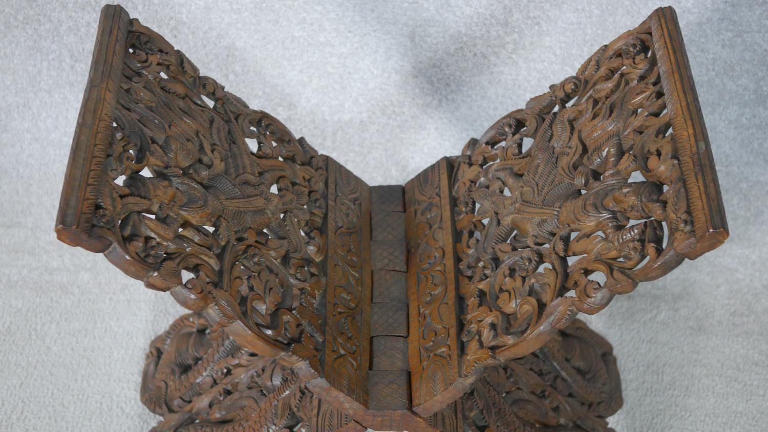 An Anglo-Indian carved pierced hardwood book stand. Decorated with dragons, foliage and flowers - Image 5 of 6