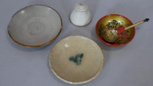 A collection of ceramics and lacquered items. Including two glazed ceramic plates one with linear