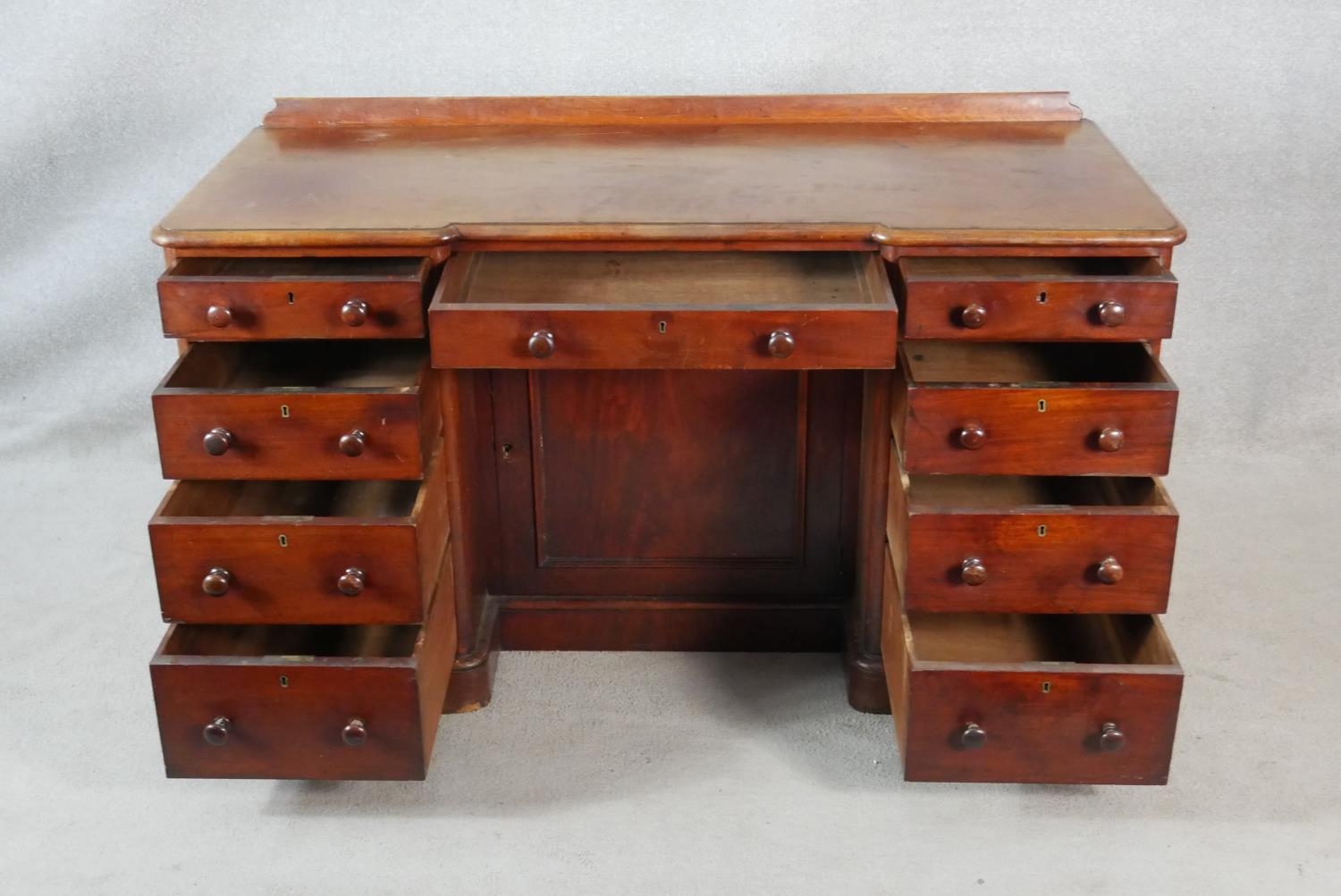 A 19th century mahogany pedestal desk with an arrangement of drawers and kneehole cupboard on plinth - Image 2 of 10