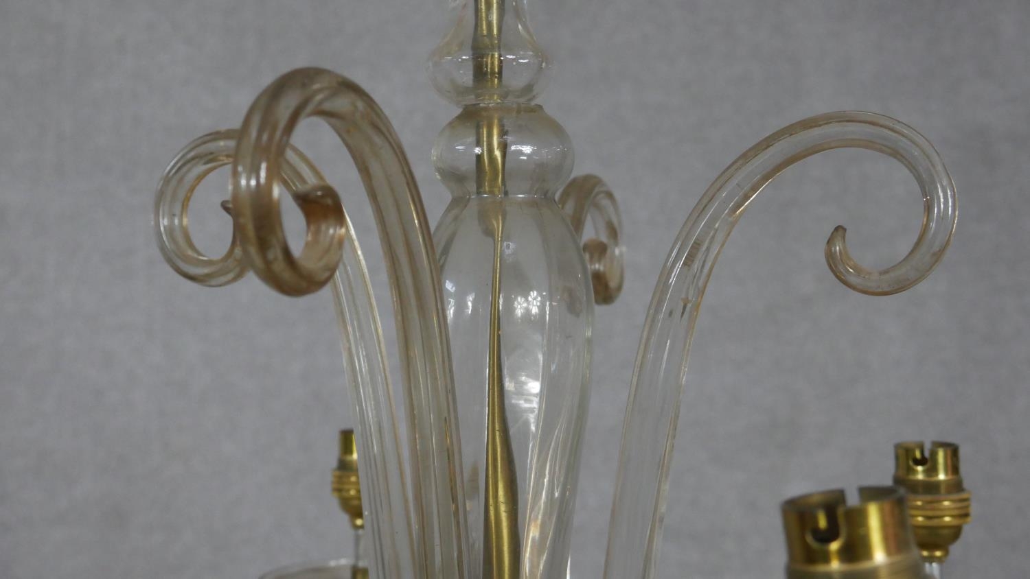 A Venetian style four branch glass chandelier with scrolling arms and finials. D.49cm (small break - Image 2 of 5