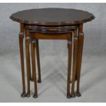 A mid century burr walnut nest of tables in the Queen Anne style. H.58 L.59 W.41cm