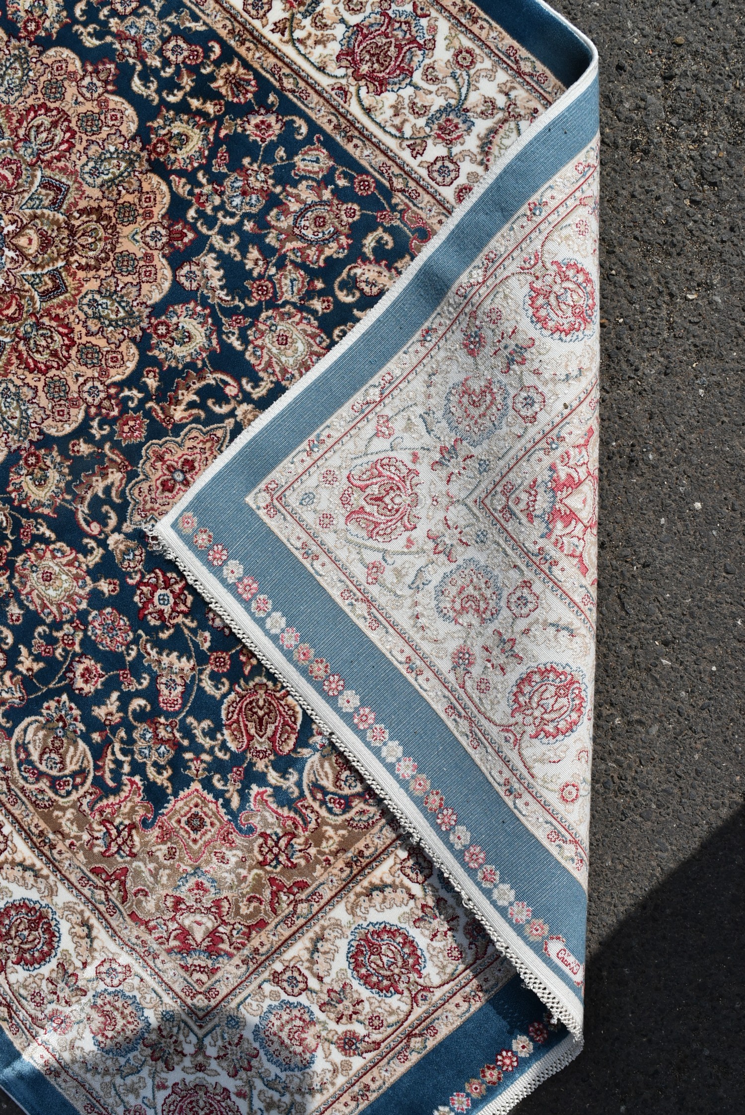 A Persian style rug with central floral medallion on a sapphire ground contained by naturalistic - Image 4 of 4