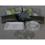 A collection of contemporary trays, beaded place mats and five silk and velvet designer cushions,