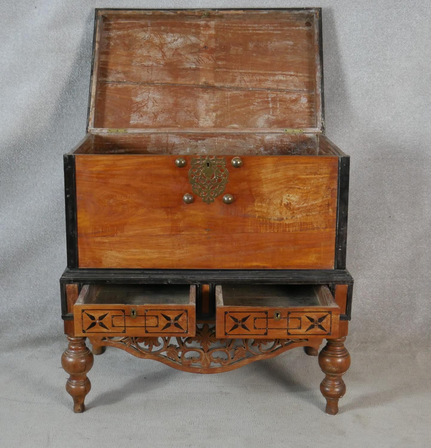 A Nineteenth Century Ceylonese hardwood and ebonised coffer on carved stand fitted with two base - Image 2 of 6