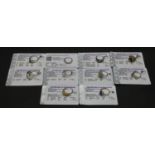 Ten gemstone set rings with certificates. To include a 9ct yellow gold Ethiopian opal and emerald