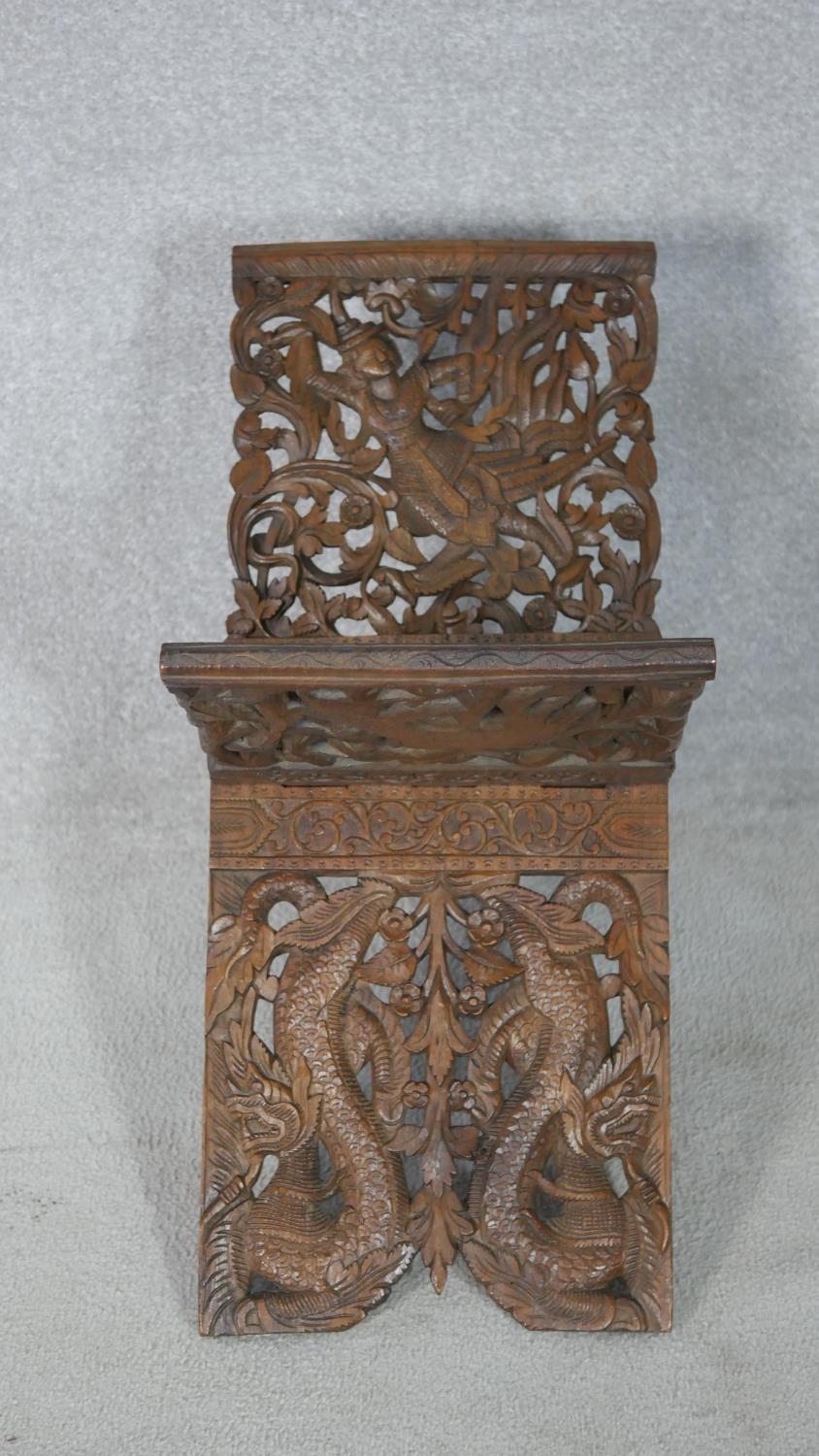 An Anglo-Indian carved pierced hardwood book stand. Decorated with dragons, foliage and flowers - Image 2 of 6