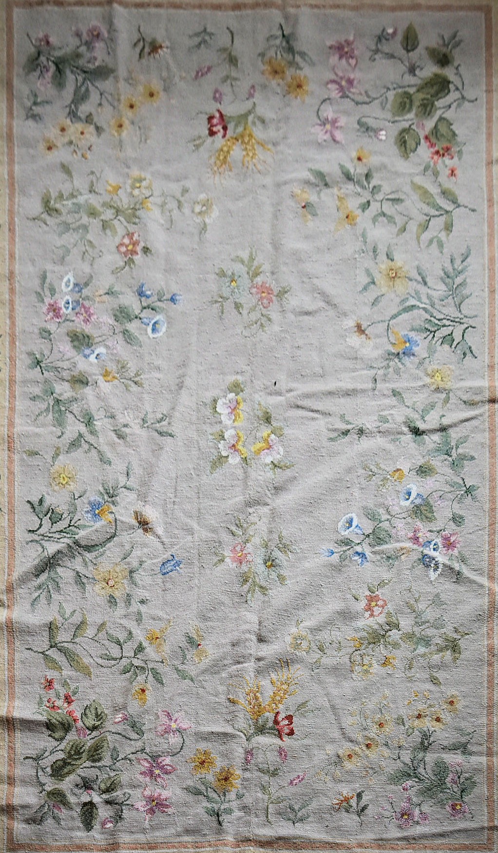 A needlepoint rug with foliate and wild flower sprays across a fawn field contained by garlands of - Image 2 of 4