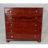 A 19th century chest with three bijouterie drawers above a flame mahogany and crossbanded deep