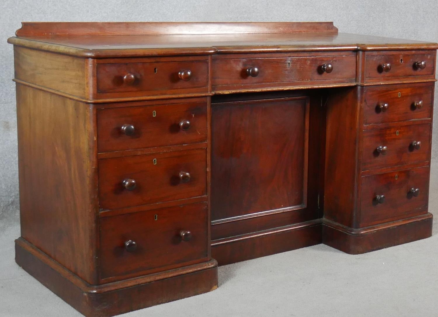 A 19th century mahogany pedestal desk with an arrangement of drawers and kneehole cupboard on plinth - Image 10 of 10