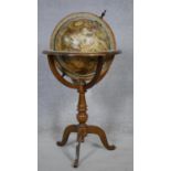 A vintage terrestrial globe on mahogany stand showing the discoveries of the Old World. H.89cm