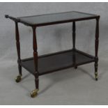 A beech and brass drinks trolley with glass inset top. H.69 L.80 W.42cm