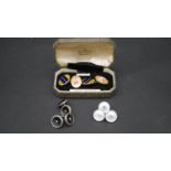 A collection of cufflinks and shirt buttons. Including a boxed set of gold cased enamel Dulwich