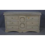 A Continental painted chest of six drawers with limestone slab top on shaped bracket feet. H.90 W.