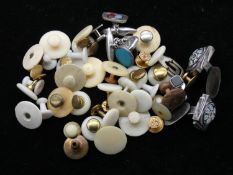 A collection of cufflinks and shirt studs. To include a pair of hallmarked silver and millefiori