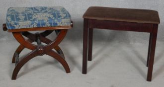 A 19th century mahogany piano stool with rise and fall action and floral loose cover and a