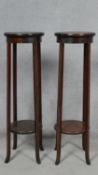 A pair of C.1900 mahogany torchières with central satinwood and olivewood fan inlay. H.98 D.30cm