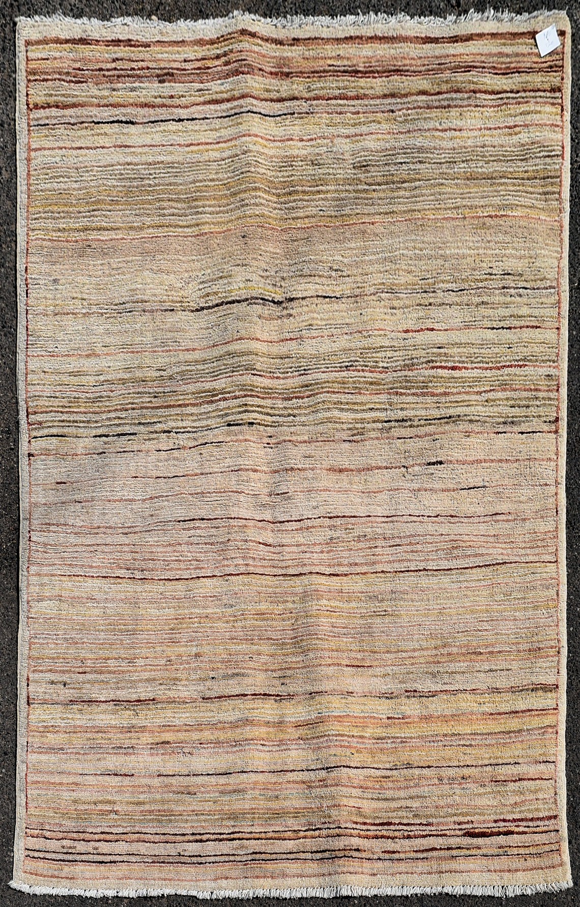 A modern rug with cross weave in hues of red and beige L.140 W.100cm