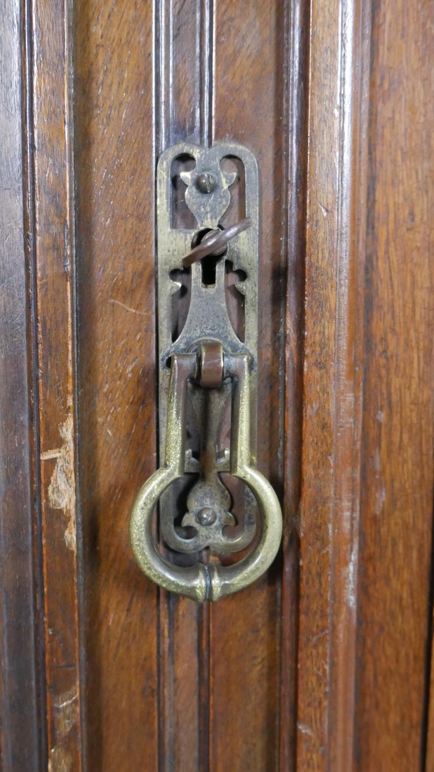 A pair of Victorian carved walnut hall cupboards with panel doors enclosing hanging space. H.183 W. - Image 5 of 10