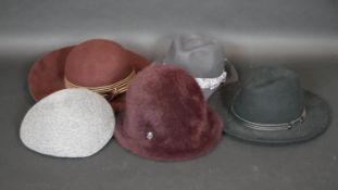 A collection of five ladies hats with designer labels including Gabriela Ligenza, Philip Treacy etc,
