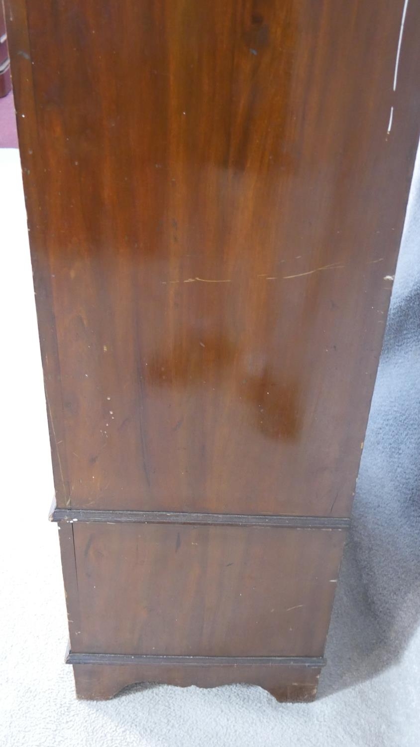 A late Victorian carved walnut wardrobe with bevelled mirrored door enclosing hanging space above - Image 15 of 23