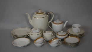 A collection of gilded dinner ware. Including a Mitterteich Bavarian gilded part four person