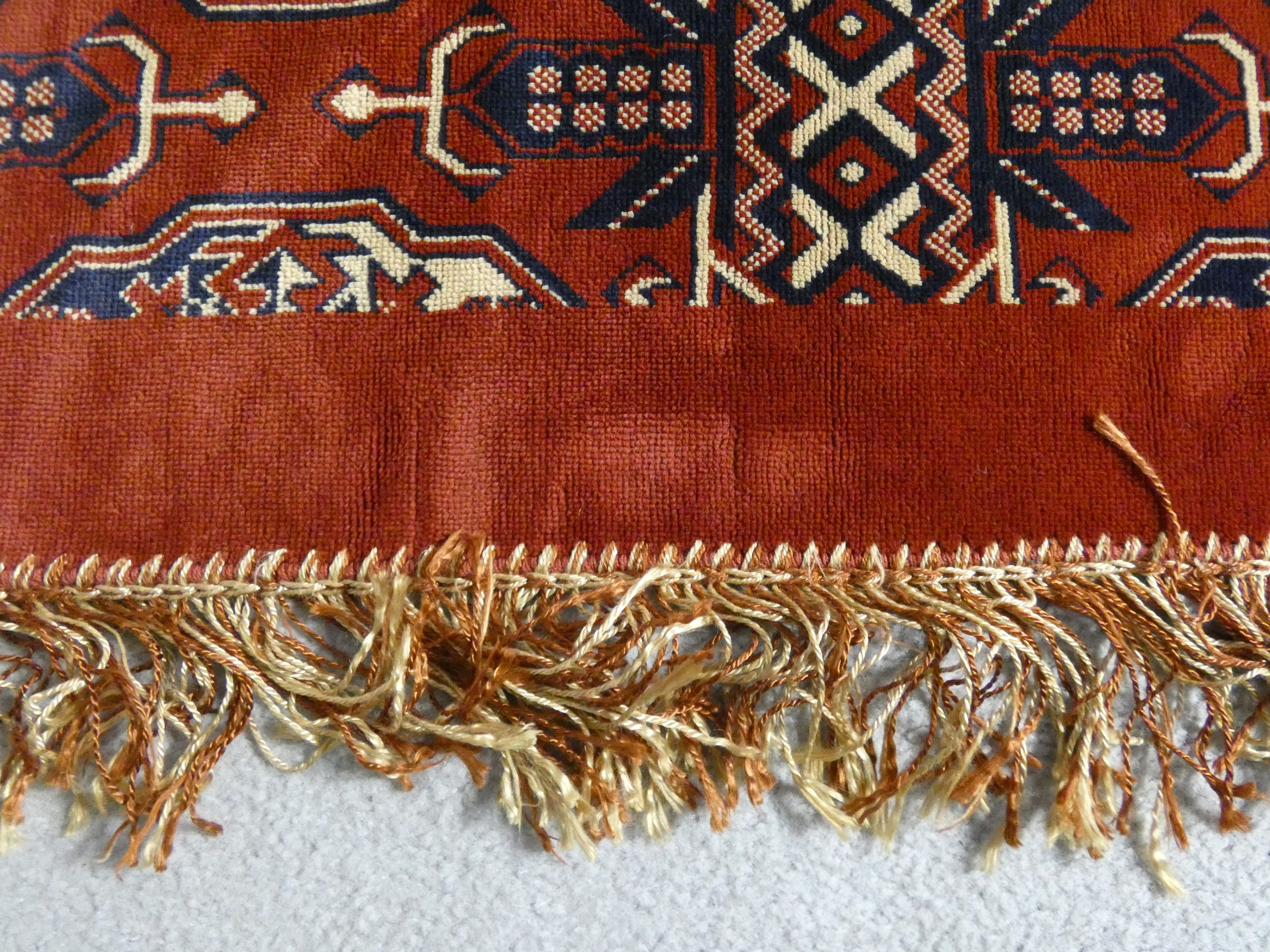 A Bokhara style carpet with repeating gull motifs on a madder field in a plain border along with a - Image 11 of 11