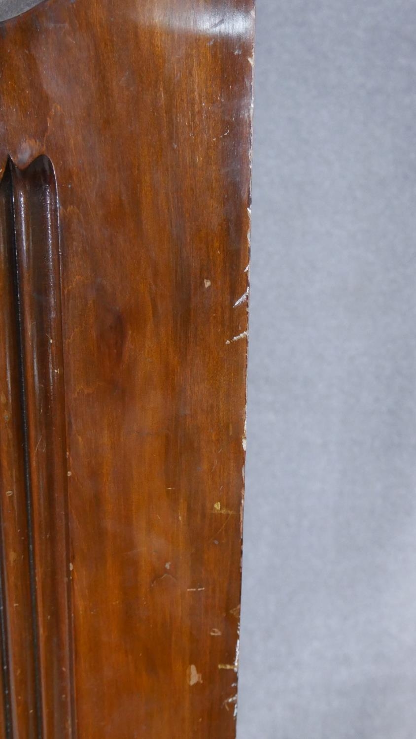 A late Victorian carved walnut wardrobe with bevelled mirrored door enclosing hanging space above - Image 19 of 23