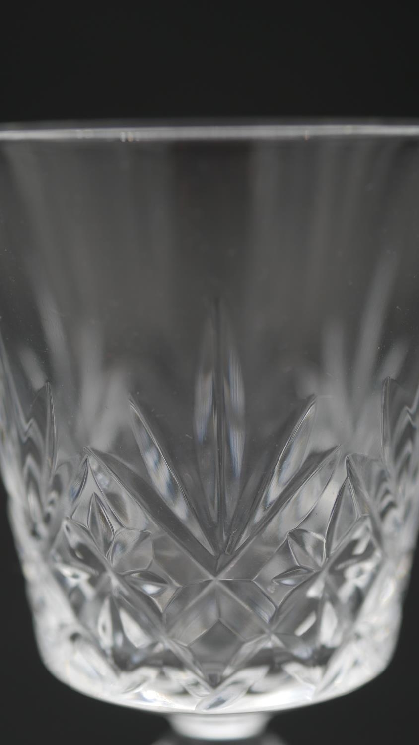 A collection of sixteen cut crystal glasses. Including a set of four foliate design wine glasses, - Image 11 of 11