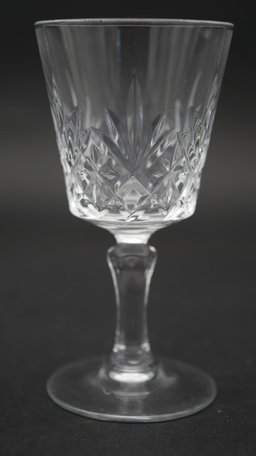 A collection of sixteen cut crystal glasses. Including a set of four foliate design wine glasses, - Image 10 of 11