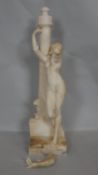 An antique carved marble statue of a Classical style female on a column with lion to the base. (