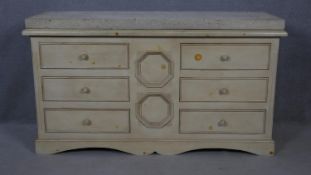 A Continental painted chest of six drawers with limestone slab top on shaped bracket feet. H.90 W.