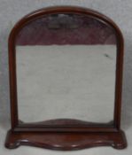 A 19th century mahogany framed dressing mirror on shaped platform base. H.55 W.50cm